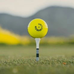 Uncommon Model 55 Golf Ball - Open Invite Edition / Electric Yellow / Dozen -COBRA Shop uncommon model 55 open invite edition 1